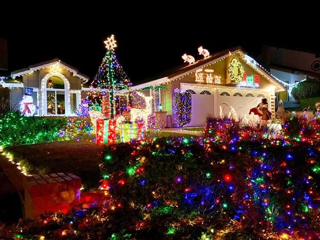 Exterior of a home covered in Christmas lights.